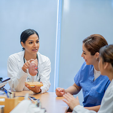 Doctors meeting around a table